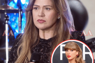 “WHEN KELLY SAID ‘ENOUGH IS ENOUGH,’ NO ONE KNEW TAYLOR SWIFT WAS WAITING IN THE DARK…”  What started as just another Nashville concert turned into a night the music world will never forget. The lights went out, the crowd held its breath — and then Taylor Swift appeared beside Kelly Clarkson. No introduction. No warning. Just a piano, two microphones, and an electric tension that could be felt in every heartbeat.  What followed wasn’t a duet — it was a declaration. Kelly’s raw emotion collided with Taylor’s fearless intensity, creating a song that wasn’t polished for radio but forged in rebellion. When the last note hit, a single line flashed across the stage: “You know what this is about.”  Those five words ignited a cultural firestorm. Within minutes, #KellyAndTaylor trended worldwide. Was it a protest against the industry? A message to someone specific? Or the beginning of a movement only they understand?  Whatever the truth, one thing is clear — Kelly Clarkson and Taylor Swift didn’t just perform together. They rewrote what music can mean when artists stop playing nice and start speaking truth|KF