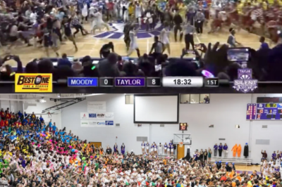 Chaos erupts at Taylor University as fans storm the court in a wild, cinematic ‘Silent Night’ tradition — a thunderous celebration that turns a 118–33 blowout into one of college basketball’s most electrifying scenes of the year.